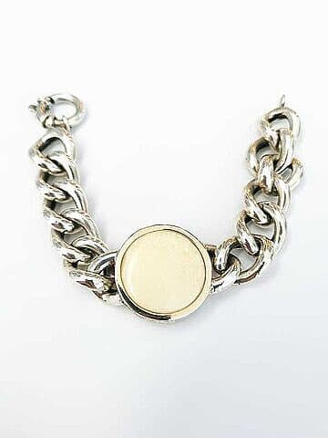 PULSEIRA EM PRATA E OURO, DE BARBELA COM MARFIM VEGETAL.